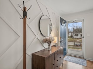 Entry to the home - coat rack, mirror, nice console entry table