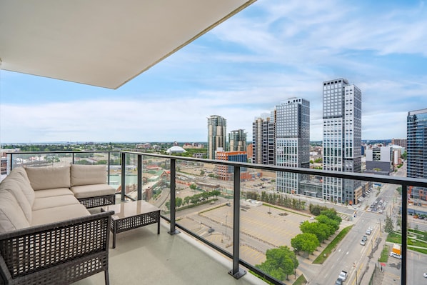 Private patio with comfortable sitting area and BBQ