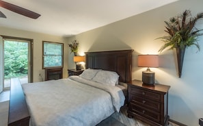 Bedroom 1 with King size bed, sofa, TV and direct access to the rear yard and pool.