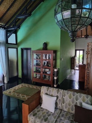 Jati's living and dining areas open onto the pool and garden