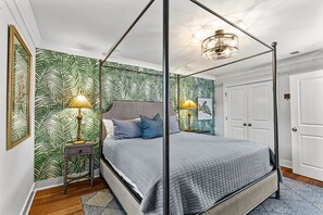 King 4 Poster bed, Luxury Linens, TV, and Tropical Decor. Shared bathroom just 3 steps away
