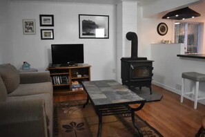 Living room with wood burning fireplace, with lake views, remodeled in 2022