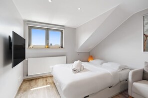 Restful retreat with cozy bedding and warm lighting to end your day in comfort. Direct bookings: www.arcaproperties.lu