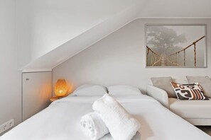 Cozy corner with a comfortable bed, ready to ensure you a restful night. Modern amenities included. Direct bookings: www.arcaproperties.lu