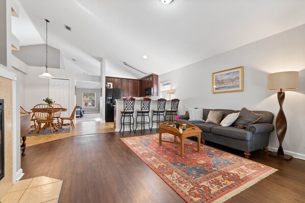 Beautiful kitchen with stylish breakfast bar, cozy family room to enjoy