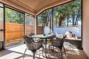 Enjoy the screened-in patio with seating for four