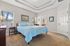 Master BR features king size bed, workspace, walk-in closet, & private bathroom