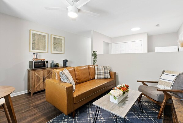 Enjoy the cozy atmosphere of the living room, perfect for relaxation and watching movies!