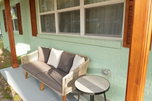 Cozy front porch sitting area. More stools in garage, which you can use here.