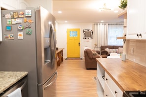 From kitchen to living room / front door.