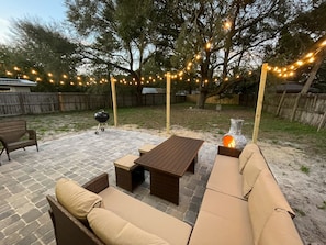 Cozy backyard hangout with grill and chimeneo