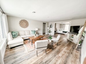 Spacious living room flows right into large master with sliding pocket doors