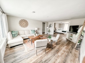 Spacious living room flows right into large master with sliding pocket doors