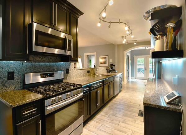 Kitchen with gas stove. 