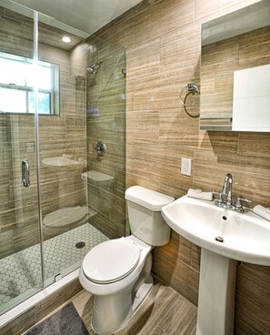 Contemporary bathroom with amenities.