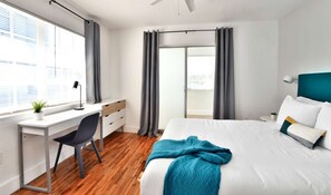 - Bright spacious bedroom workspace.