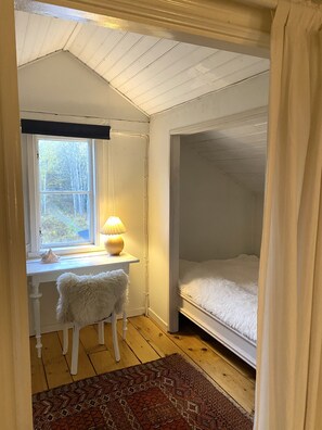 first bedroom (small double bed) at the top of the stairs. 