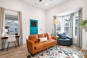 Living Space with Workspace overlooking the cute front porch