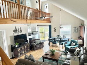Open concept great room with view to upper level
