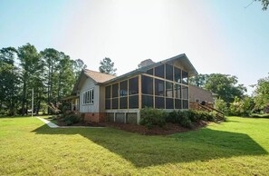 Front corner of house as seen from  next to the water.
