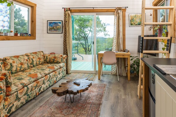 living room and ladder to loft