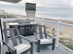 Relax and grill with stunning beachfront views on the private balcony.