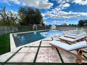 Deck lounge chairs with Estate views