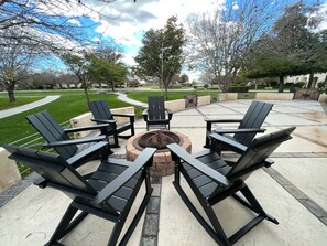 Front Porch with fire pit and rocking adirondack chairs