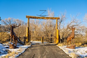 Log entrance with elk statues off Hwy 6. 