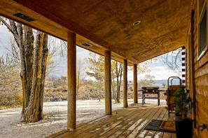 Covered deck with grill.