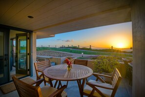 View exiting master bedroom slider into outdoor dining patio.