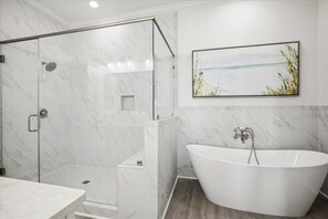 After a fun day on the beach, sink into the soaker tub with a glass of wine.