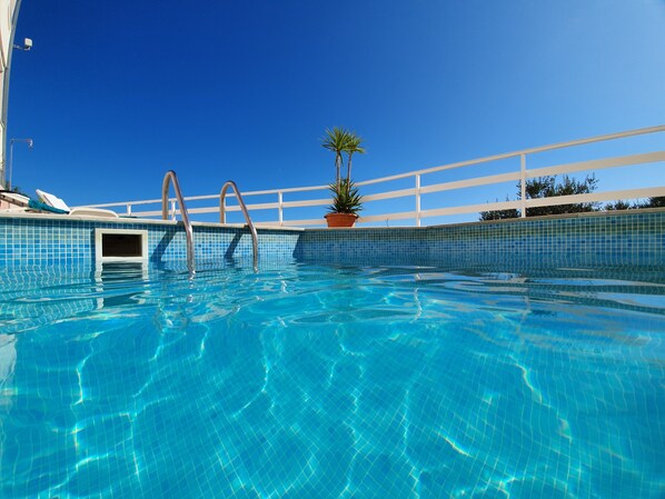 Shared pool. Beach also just a short few minutes stroll away. Beautiful water.