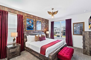 Lavish Bedroom of the Townhouse in Davenport Florida - The bedroom that is inspired by a harry potter themed design - Cozy retreat with a plush bed, perfect for relaxation - Smart use of space with efficient storage solutions