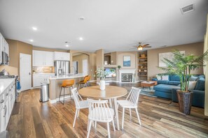 Open concept breakfast nook + Kitchen + main living area