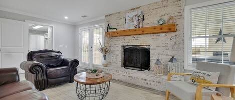 Main living area with inviting wood burning fireplace 