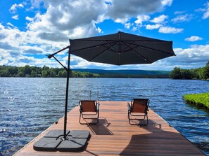 Relax on the dock. Tilting umbrella if you want shade. We have more chairs available.