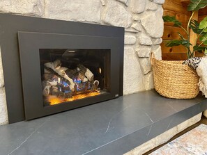 Easy to operate gas fireplace. Get cozy by the fire with the click of a button.