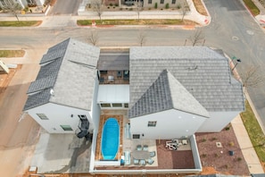 Aerial view of the wonderful home and the private Backyard.