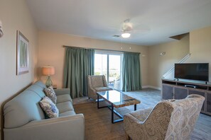 The open living room area features cable TV. 