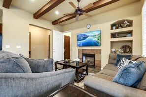 Living room with 65" Samsung Smart TV, Cable TV, Fireplace, recessed lights