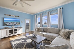 The living room window faces Scenic Drive and brings in a lot of natural light to the space.