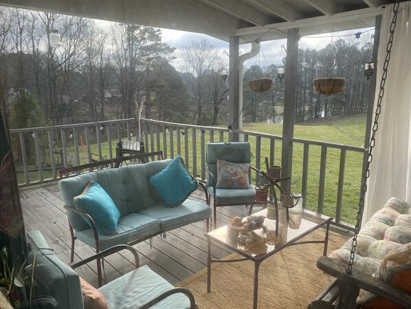 The elevated and furnished Pastoral Deck, overlooks both pastures and the pond.