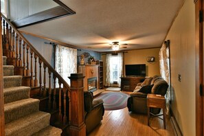 Note the wood trim and wooden banister, there are lots of little features to make you feel right at home.