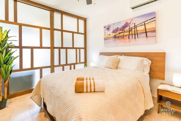 The bedroom has a queen bed
