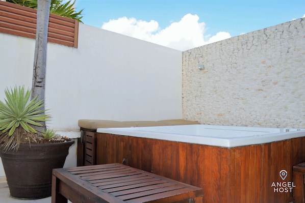 The private terrace has a spa tub to soak all your stress away!