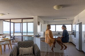 Sea breezes drift throughout the light and bright interior of this apartment.