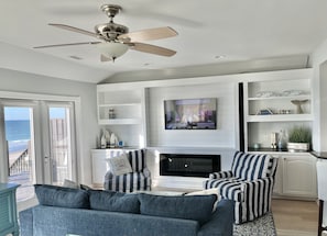 Relax and unwind with a 55” TV and electric fireplace.