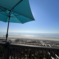 Deck has umbrella for your use.