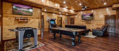 Lower level game room: foosball, pool table, multi-cade, & TV